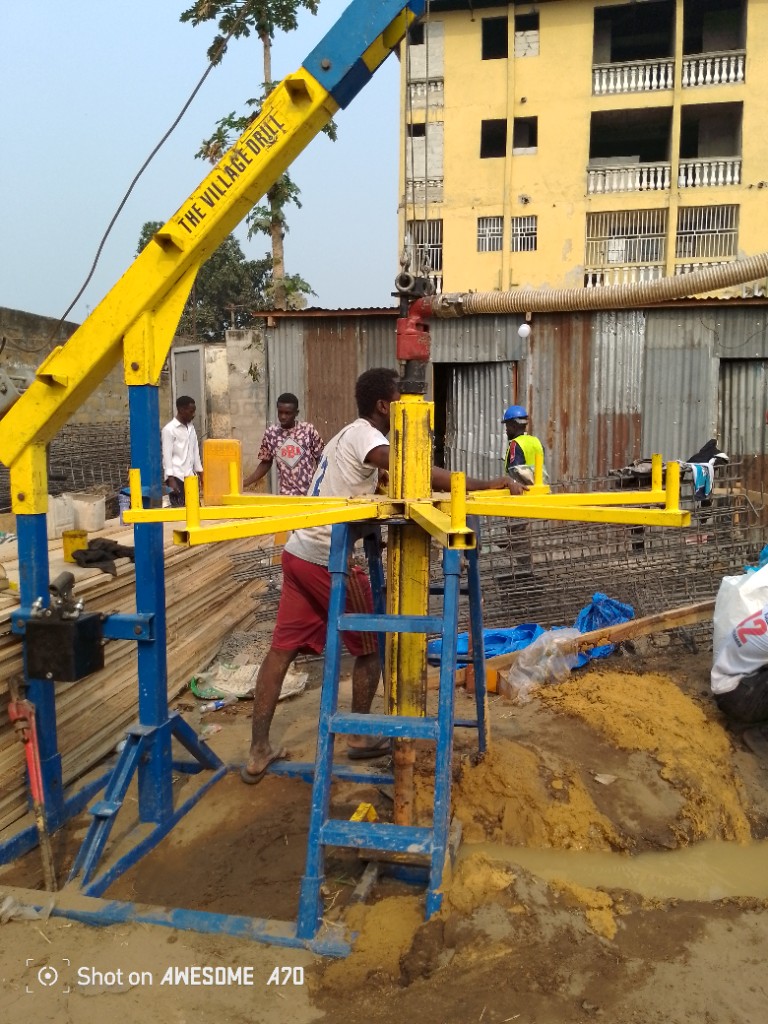 Community members operating a Village Drill to bring clean water to Kinshasa